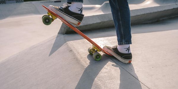 Feet in sneakers positioned for a balance exercise.